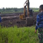 Normalisasi Kali Ngrancang, Satgas TMMD Kodim Bojonegoro Lakukan Pengawalan Alat berat