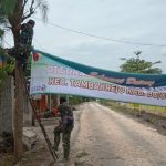 Dilokasi TMMD Kodim Bojonegoro Satgas Bentangkan Sepanduk